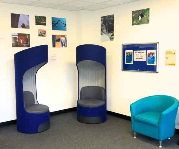 Adult waiting room with artwork displayed